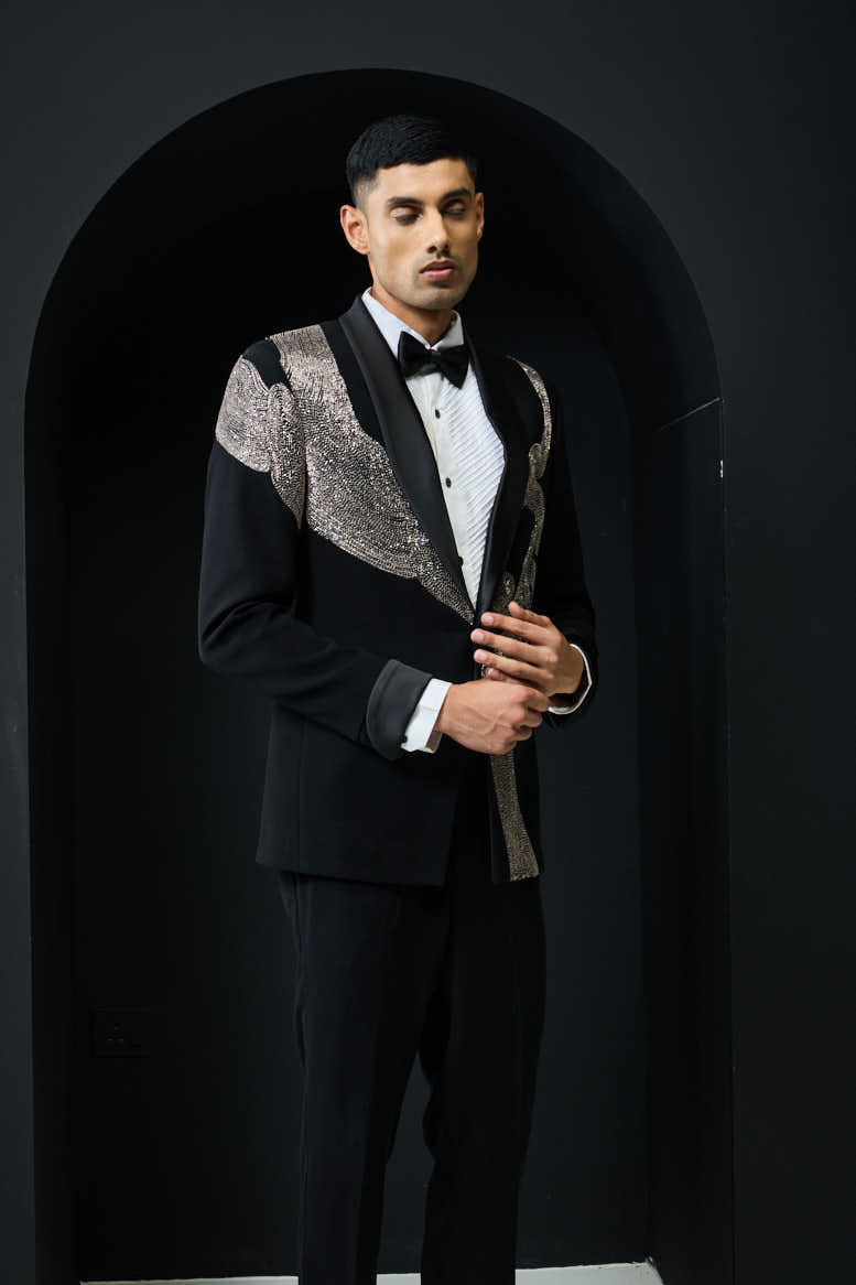 Black tuxedo highlighted with silver zari , cutdana and peals