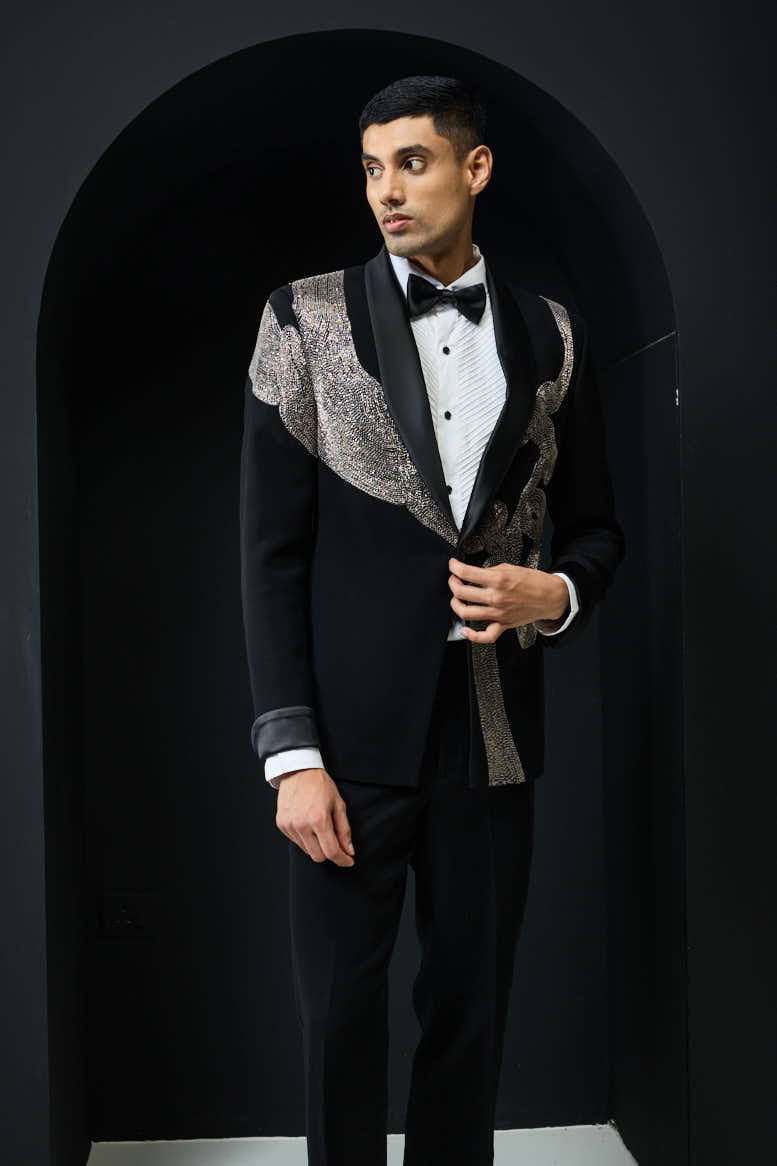 Black tuxedo highlighted with silver zari , cutdana and peals