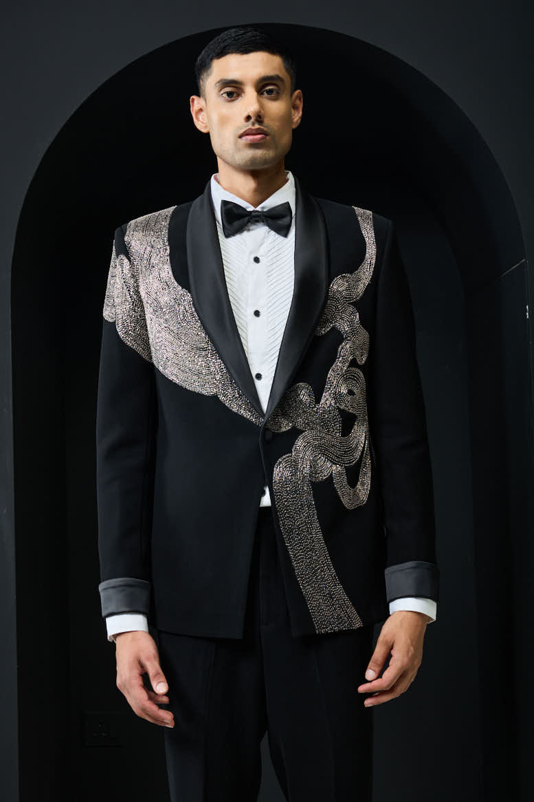 Black tuxedo highlighted with silver zari , cutdana and peals