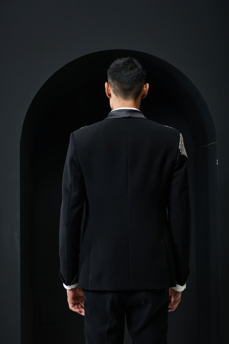 Black tuxedo highlighted with silver zari , cutdana and peals