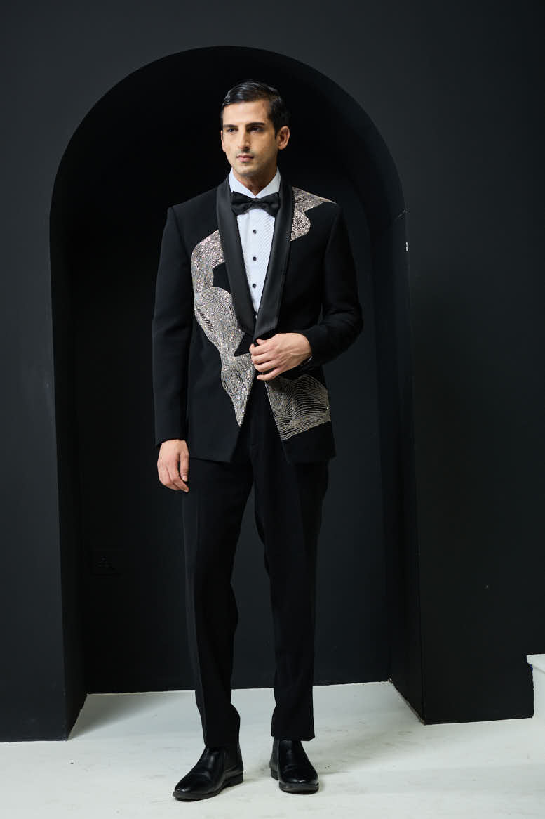 Black tuxedo highlighted with silver zari , cutdana and peals