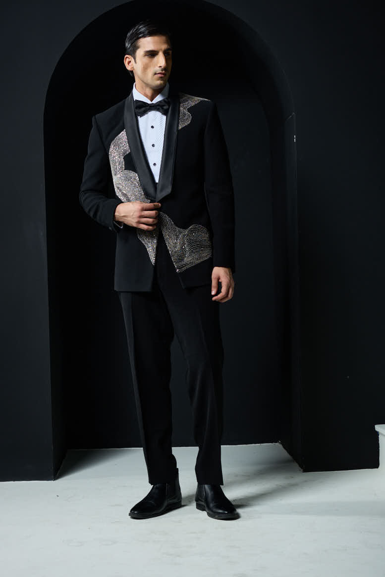Black tuxedo highlighted with silver zari , cutdana and peals