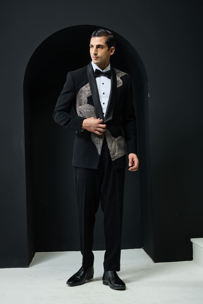 Black tuxedo highlighted with silver zari , cutdana and peals