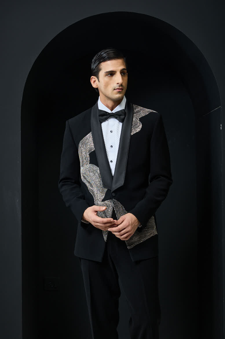 Black tuxedo highlighted with silver zari , cutdana and peals