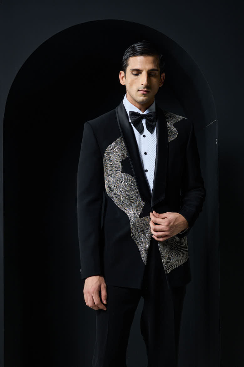 Black tuxedo highlighted with silver zari , cutdana and peals