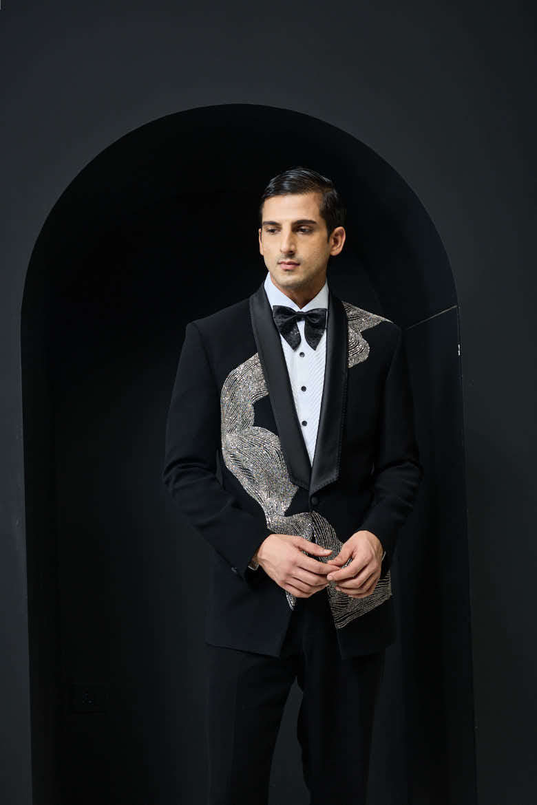 Black tuxedo highlighted with silver zari , cutdana and peals
