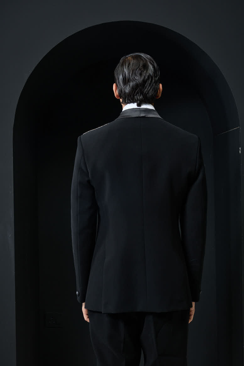 Black tuxedo highlighted with silver zari , cutdana and peals