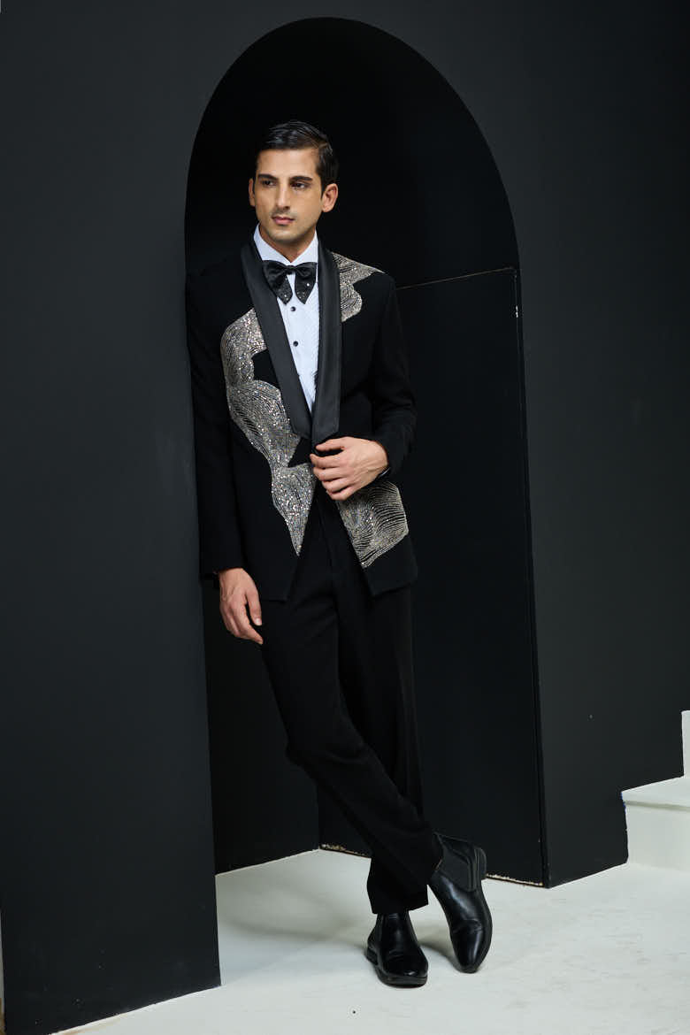 Black tuxedo highlighted with silver zari , cutdana and peals