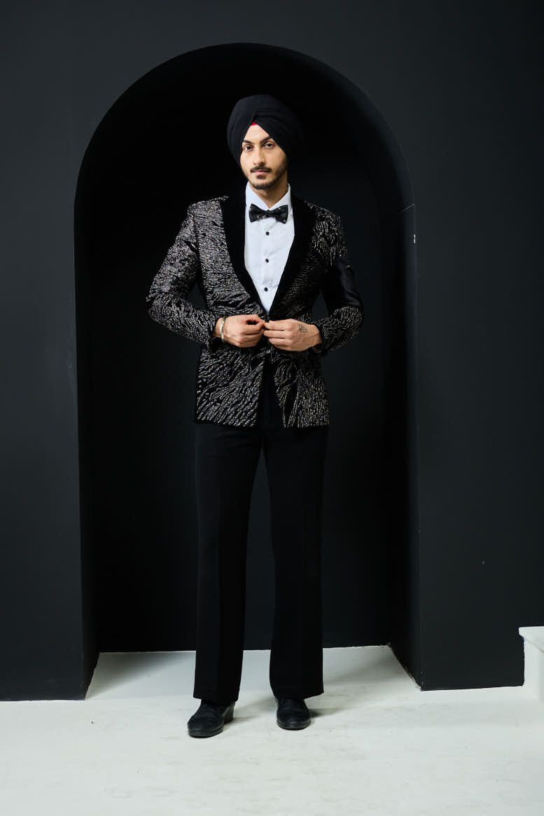 Black tuxedo highlighted with silver zari and peals