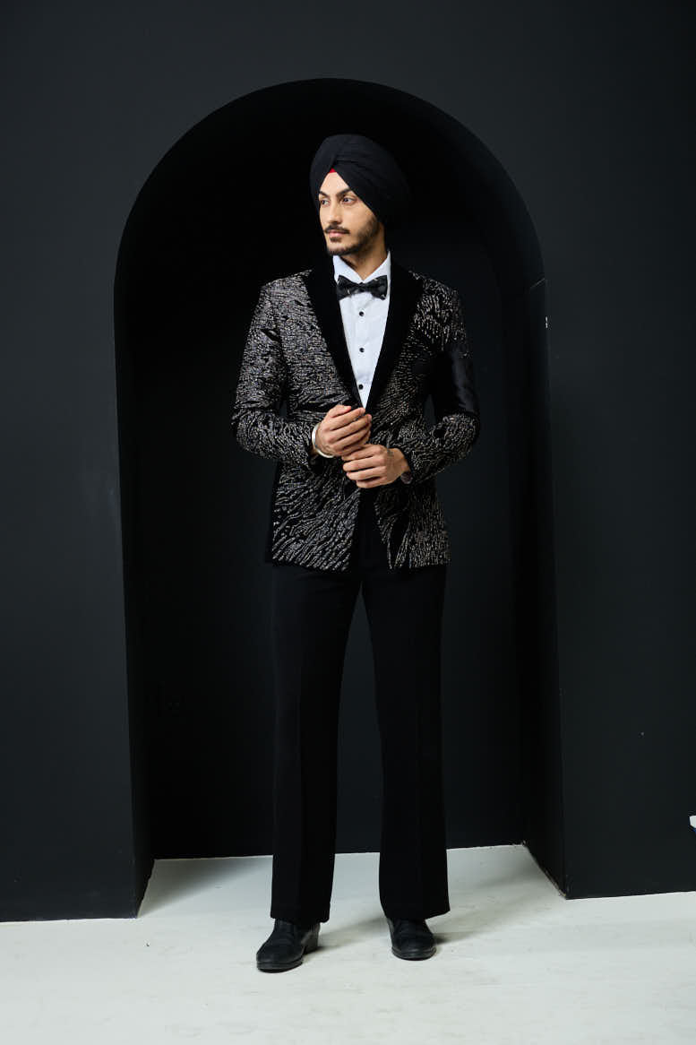 Black tuxedo highlighted with silver zari and peals