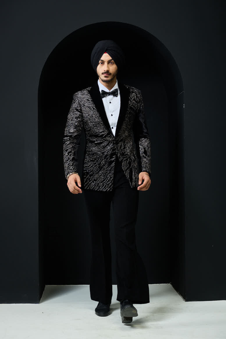 Black tuxedo highlighted with silver zari and peals