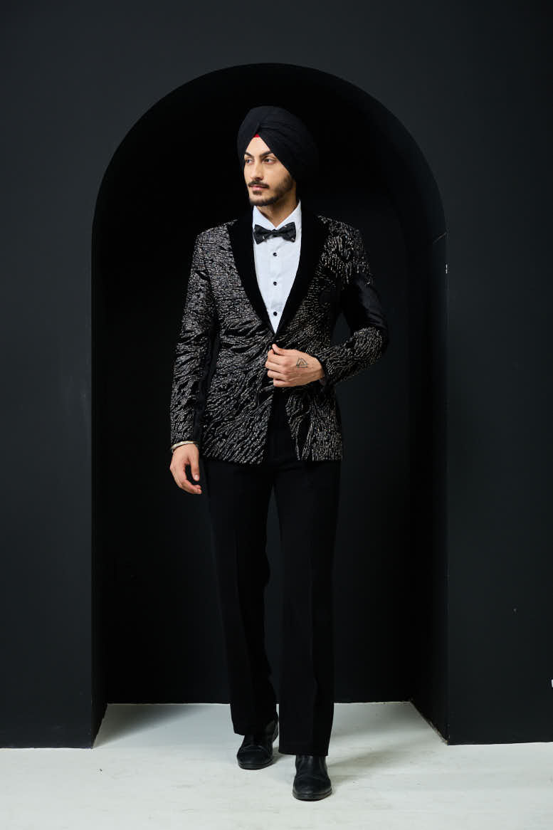 Black tuxedo highlighted with silver zari and peals