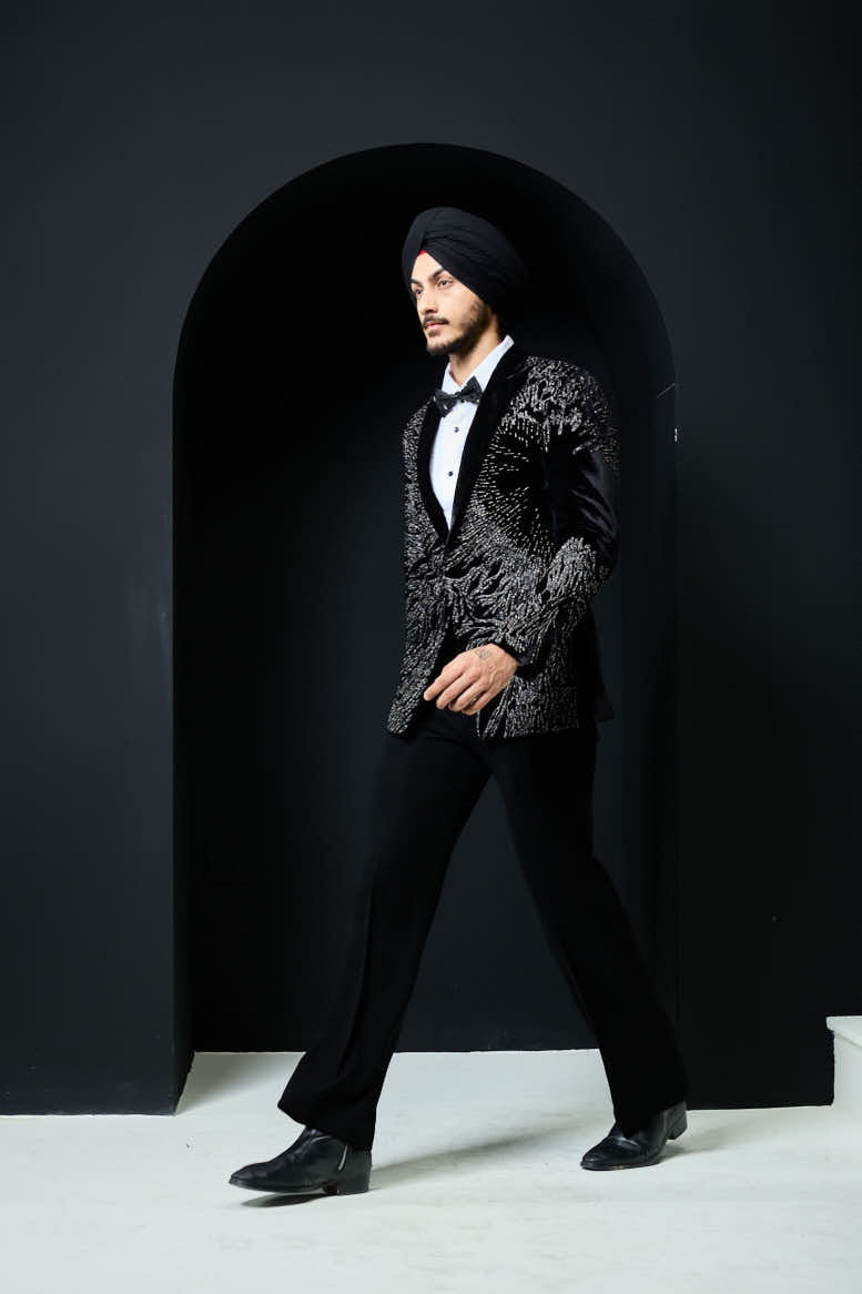 Black tuxedo highlighted with silver zari and peals
