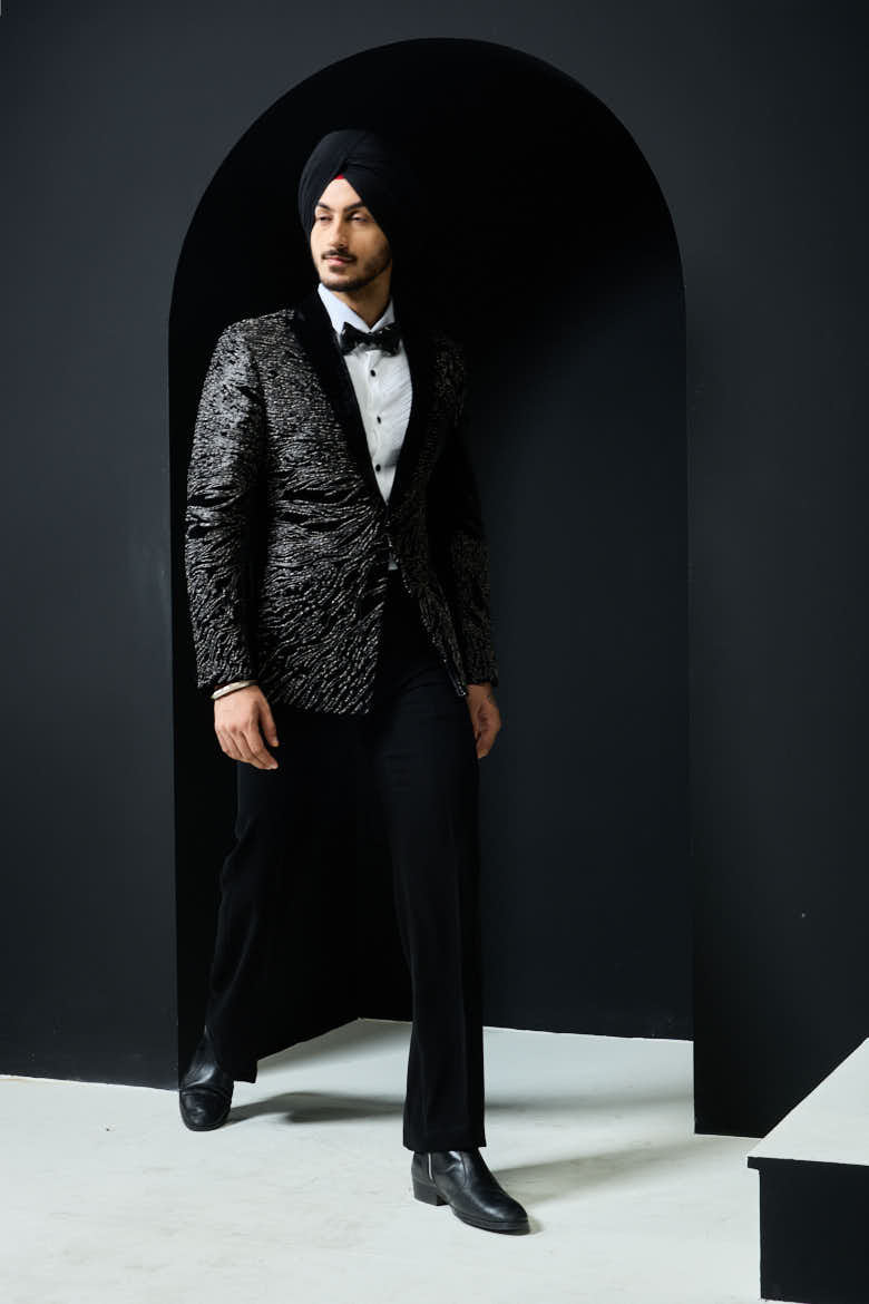Black tuxedo highlighted with silver zari and peals