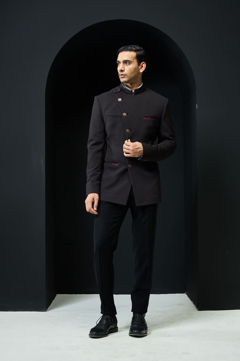 Black bandhgala with slant cut detailing with golden button and with satin taping