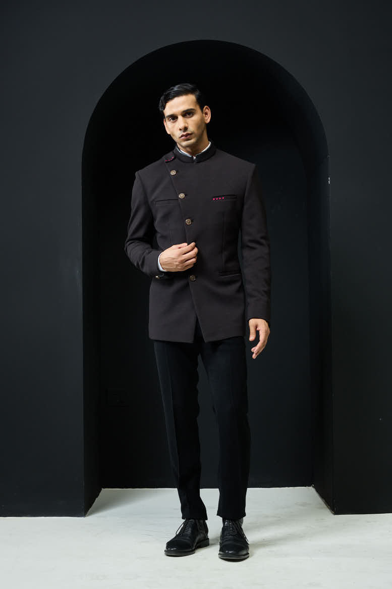 Black bandhgala with slant cut detailing with golden button and with satin taping