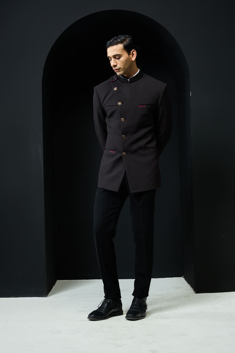Black bandhgala with slant cut detailing with golden button and with satin taping