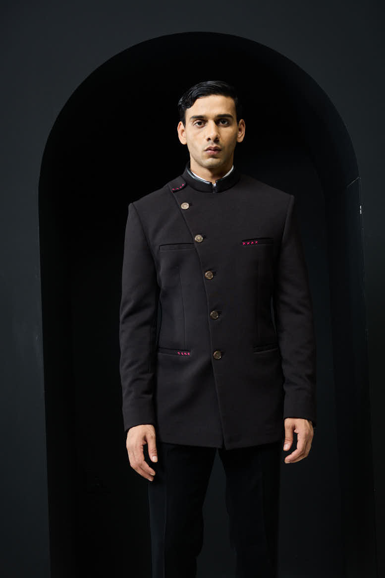 Black bandhgala with slant cut detailing with golden button and with satin taping