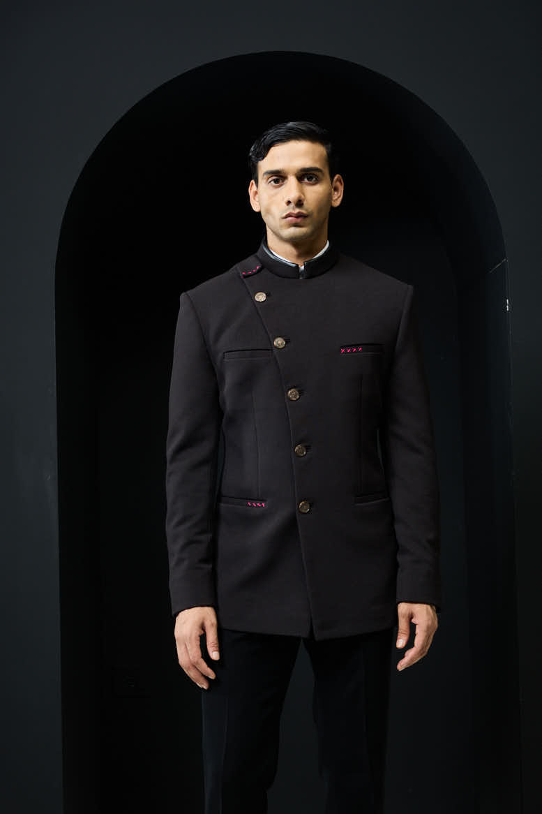 Black bandhgala with slant cut detailing with golden button and with satin taping