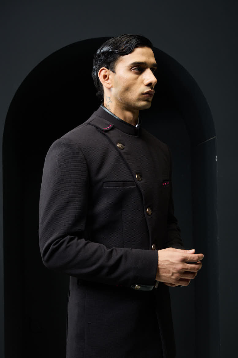 Black bandhgala with slant cut detailing with golden button and with satin taping