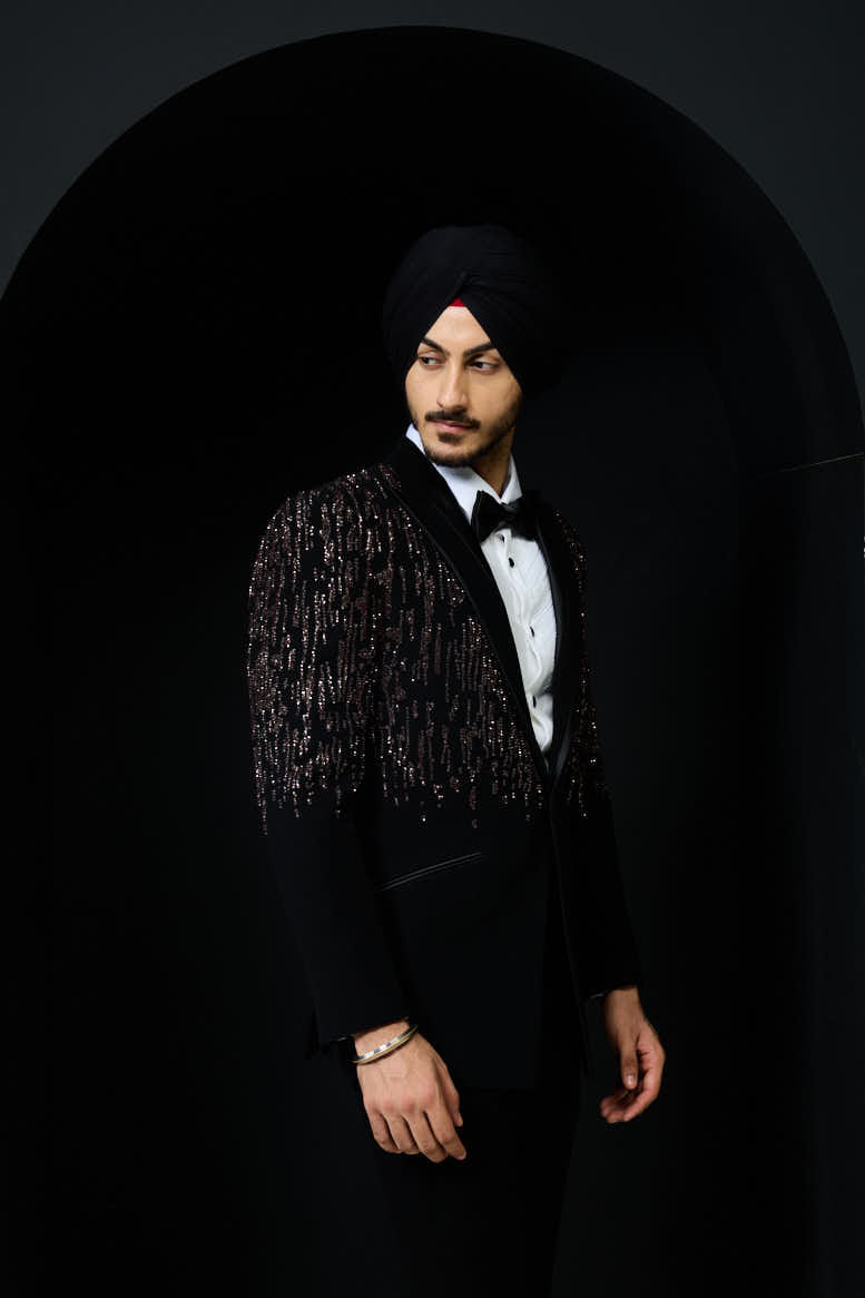 Black tuxedo highlighted with pearls, sequins and thread work