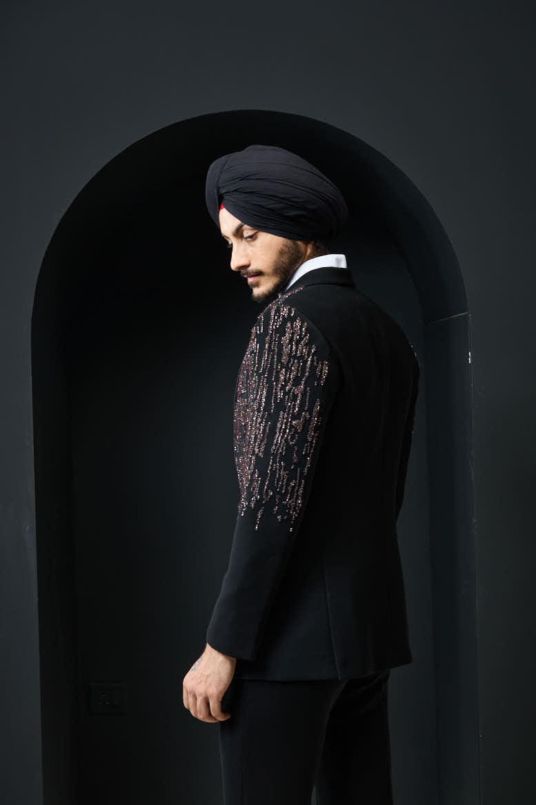 Black tuxedo highlighted with pearls, sequins and thread work