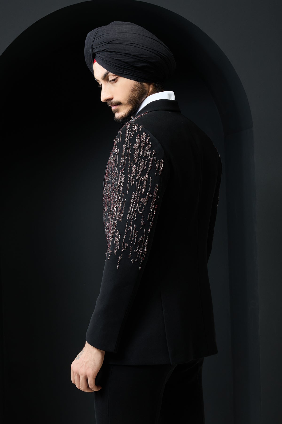 Black tuxedo highlighted with pearls, sequins and thread work
