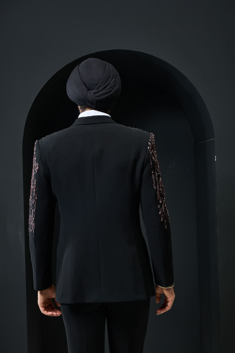 Black tuxedo highlighted with pearls, sequins and thread work