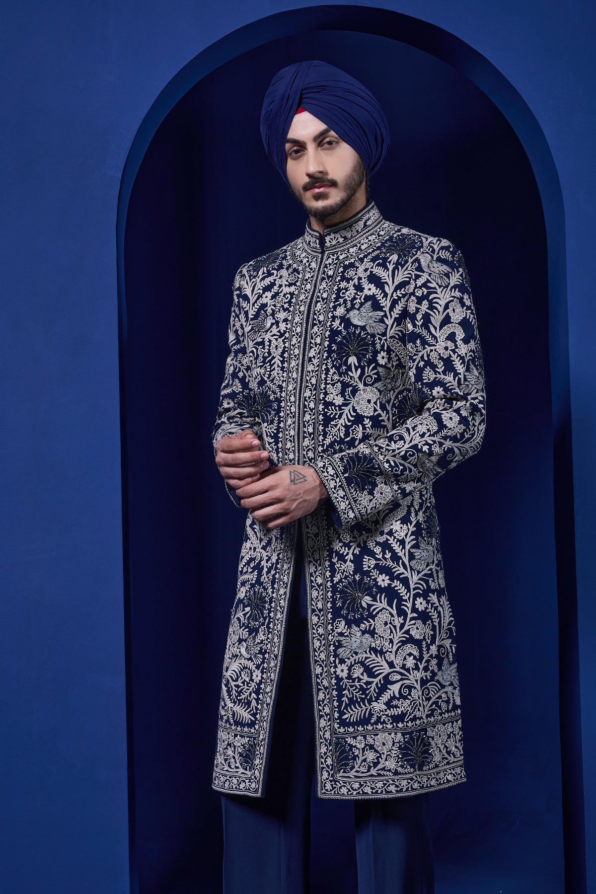 Navy blue Indo Western highlighted with sequins pearls and thread work