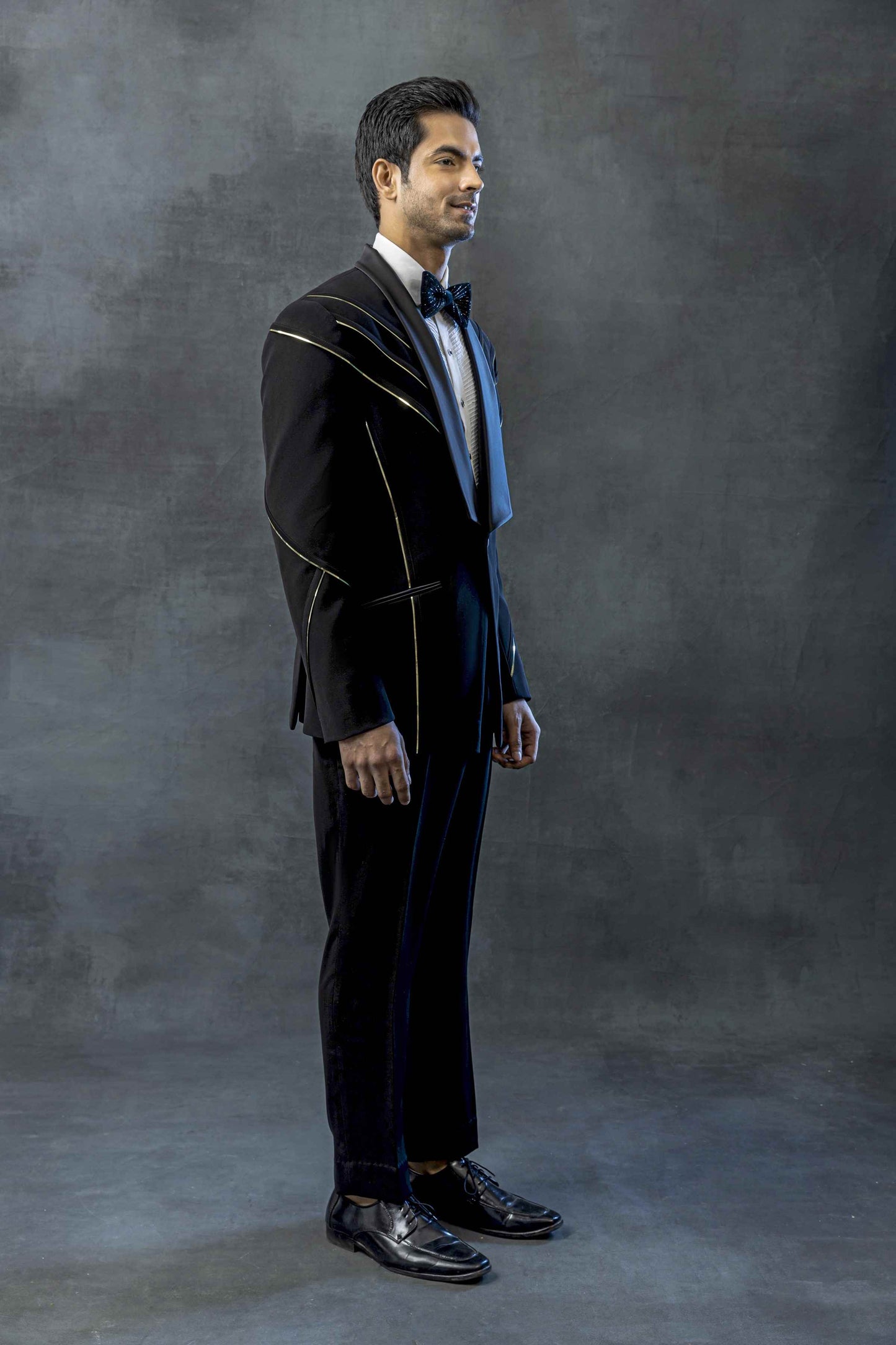 Black Tuxedo With Golden Reel Detailing