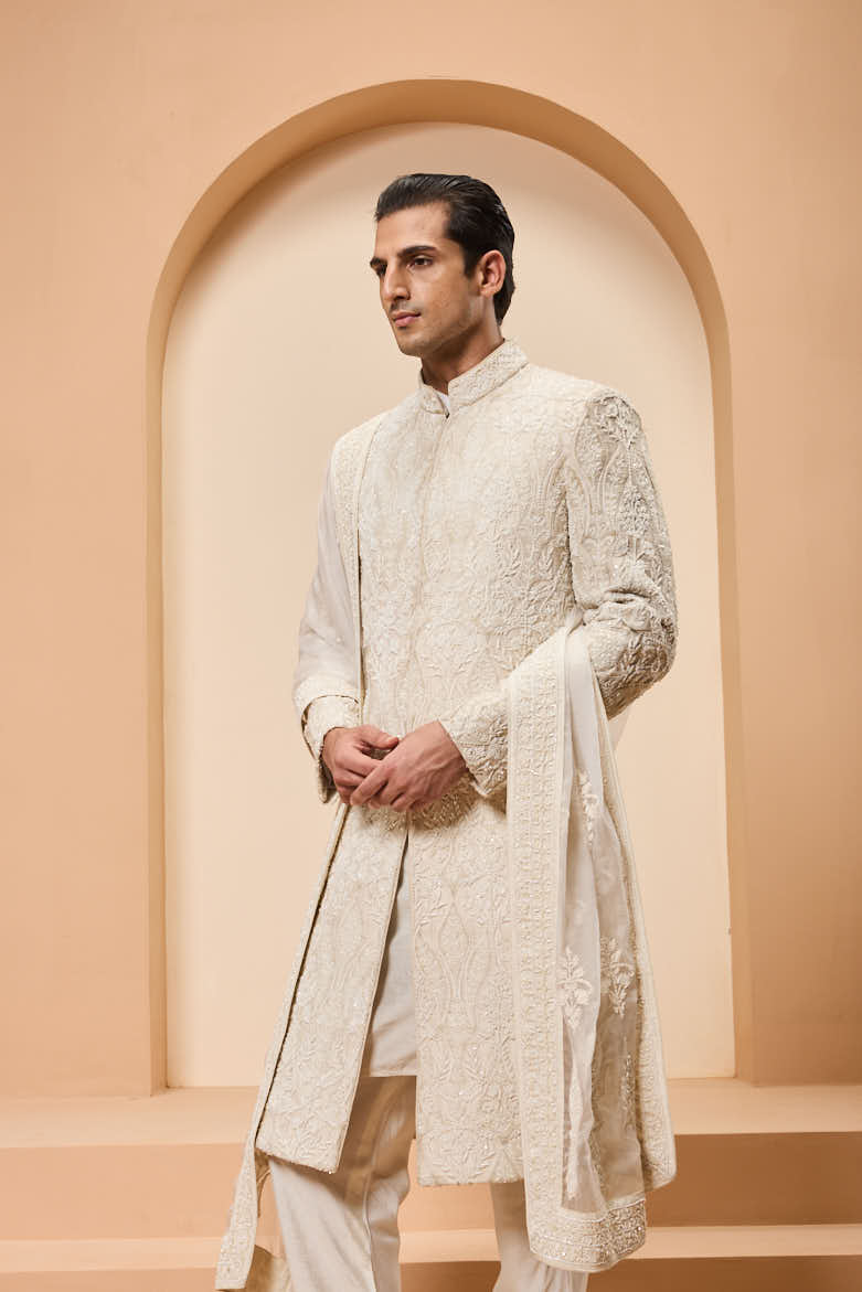Ivory sherwani detailing with pearl,sequins and aplic work