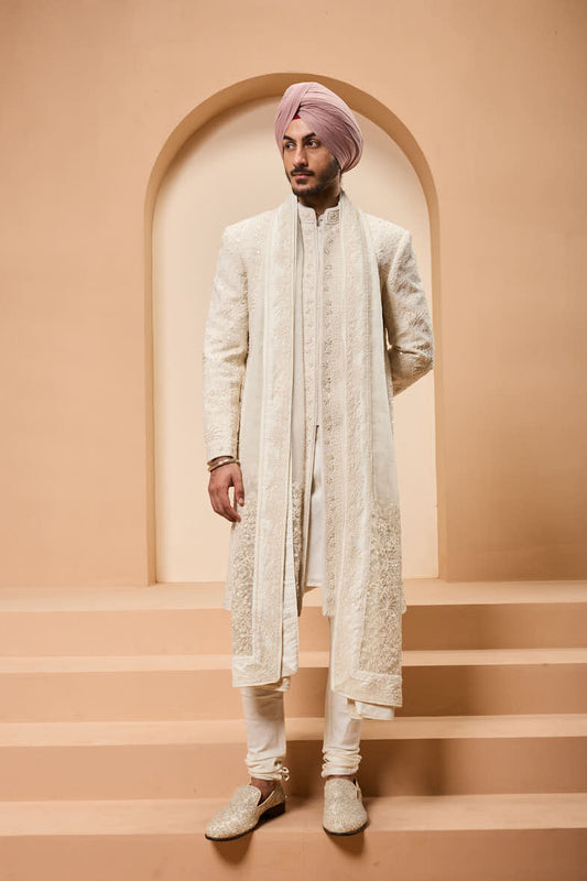 Ivory sherwani detailing with pearl,sequins and thread work
