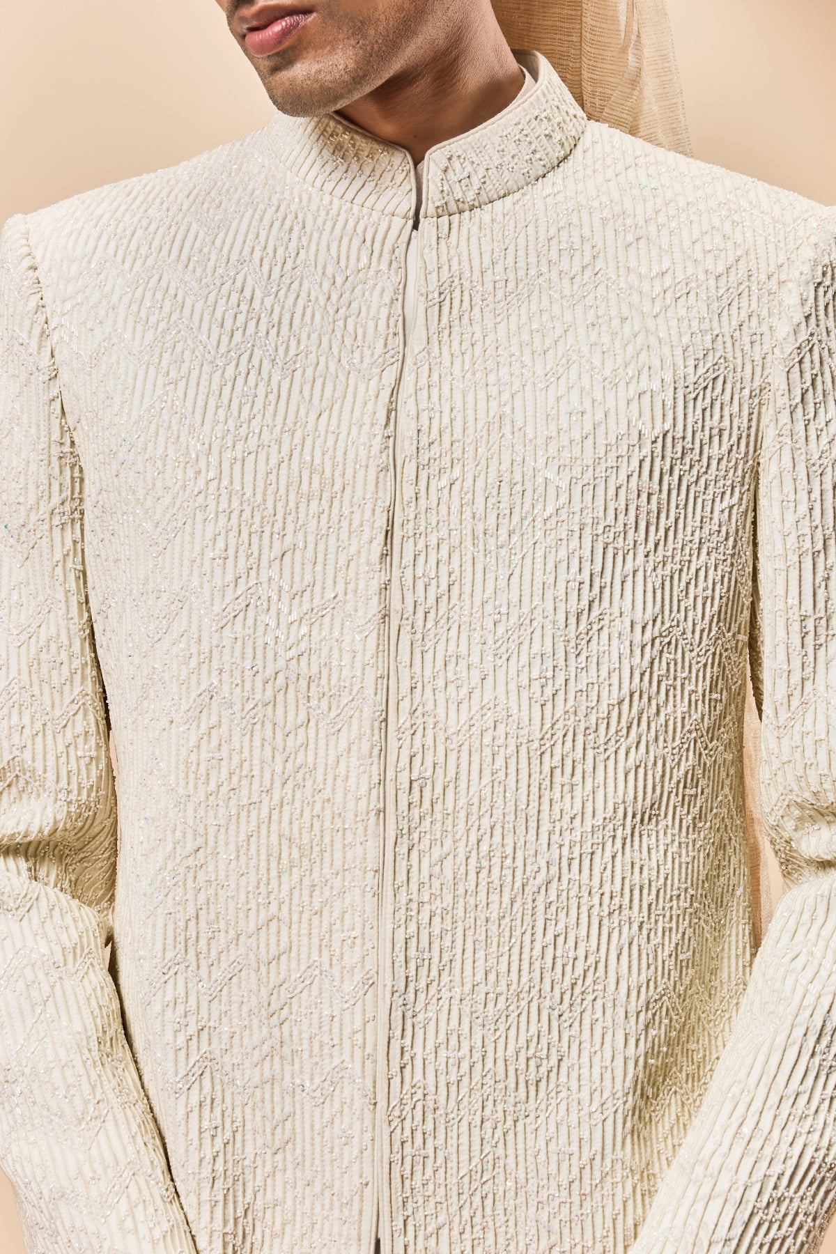 Ivory sherwani detailing with pearl,cutdana and pintex work
