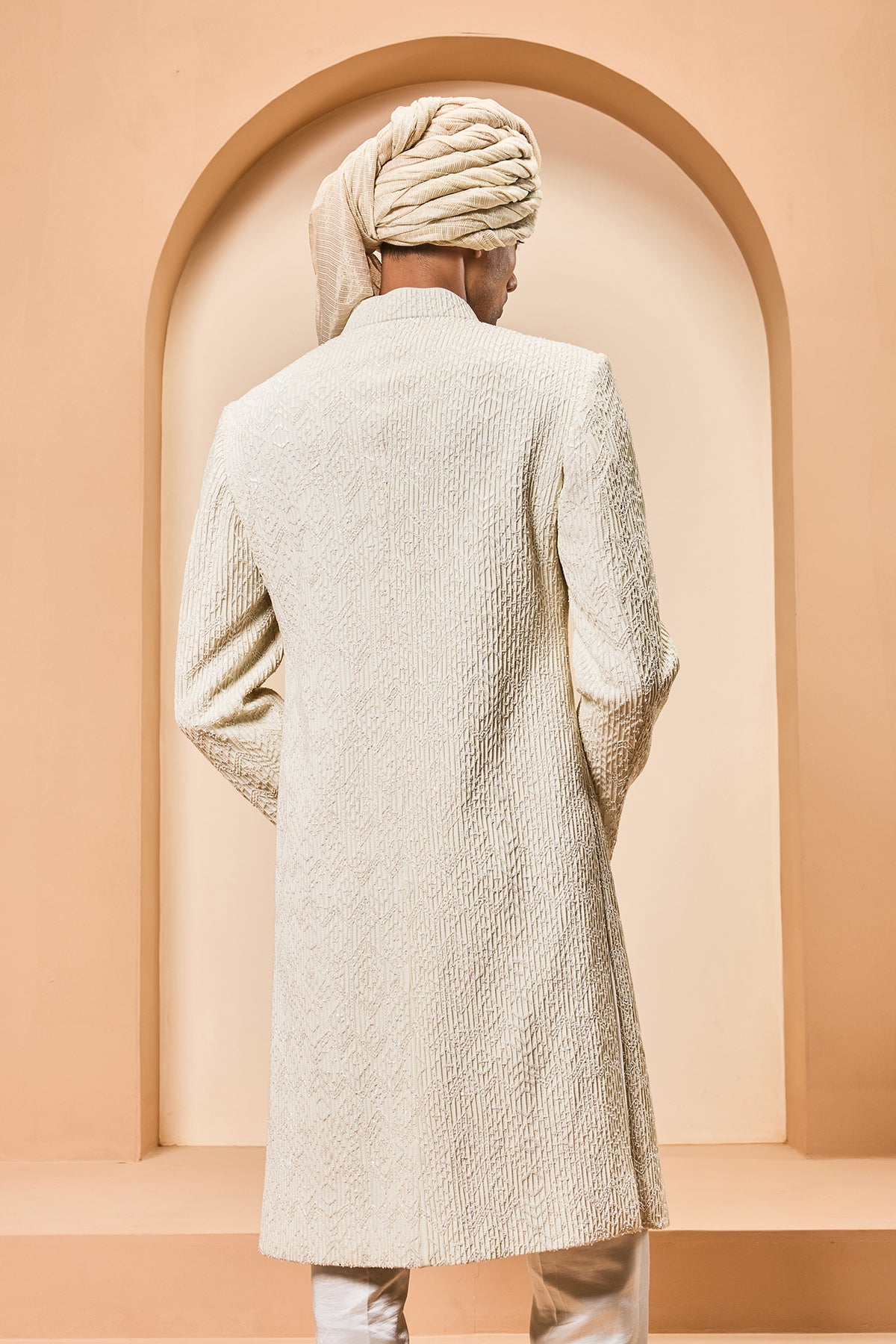 Ivory sherwani detailing with pearl,sequins and thread work
