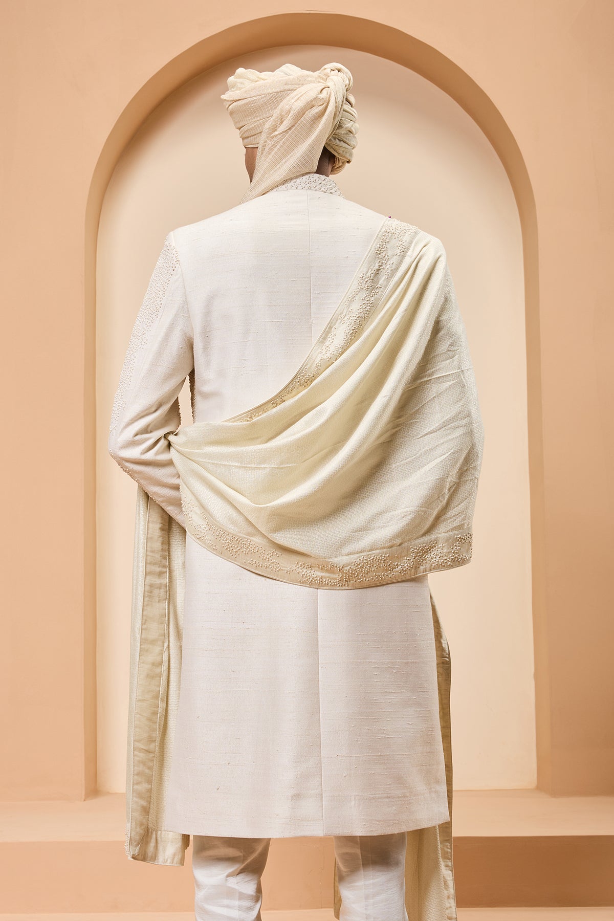 Ivory sherwani detailing with pearl,sequins and thread work