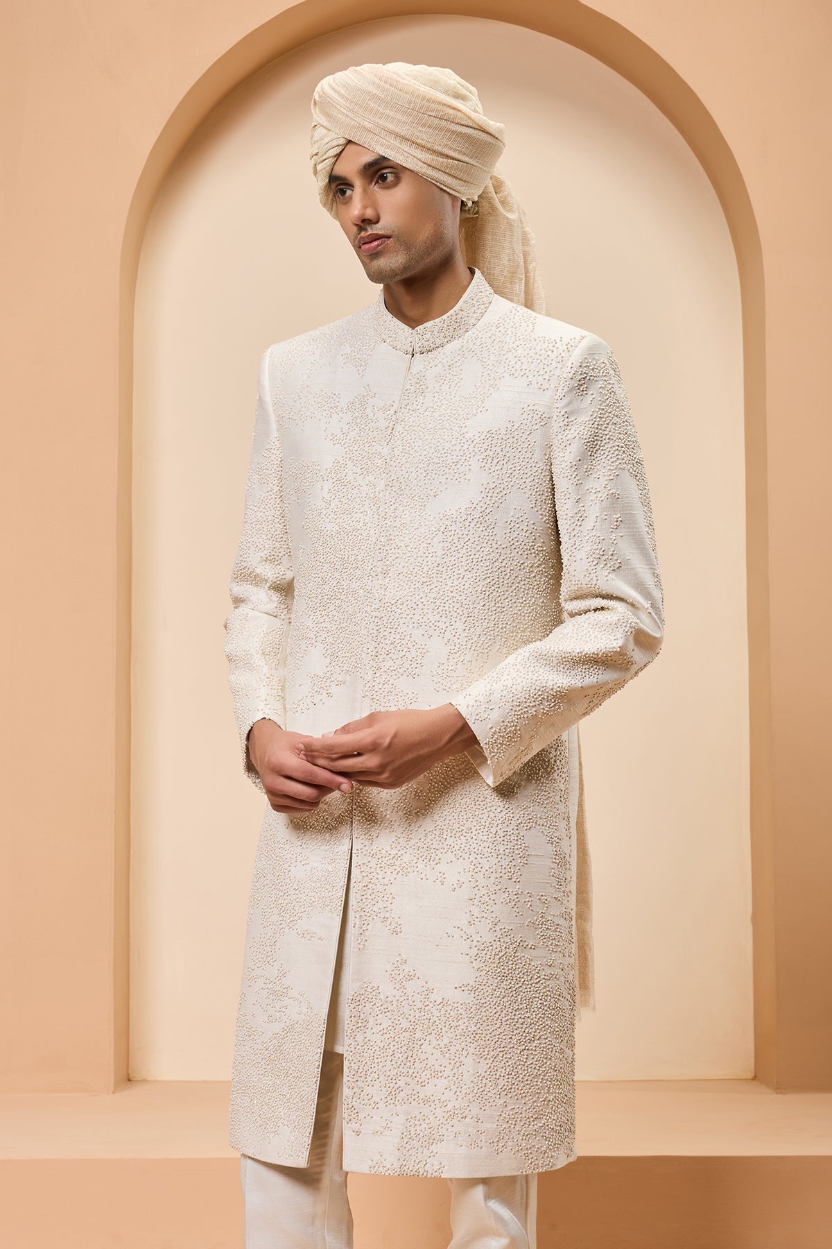 Ivory sherwani detailing with pearl,sequins and thread work