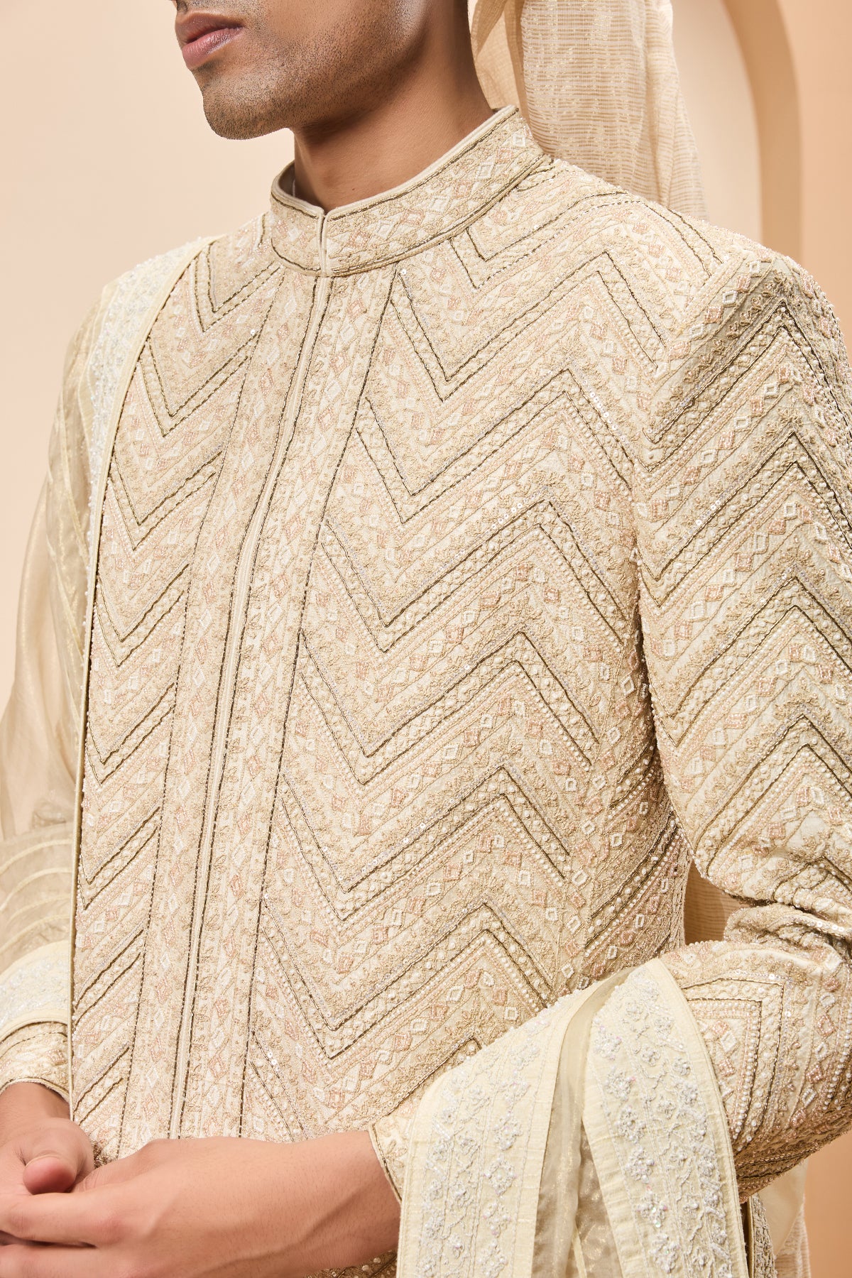 Ivory gold sherwani detailing with zardozi,pearl,sequins and thread work