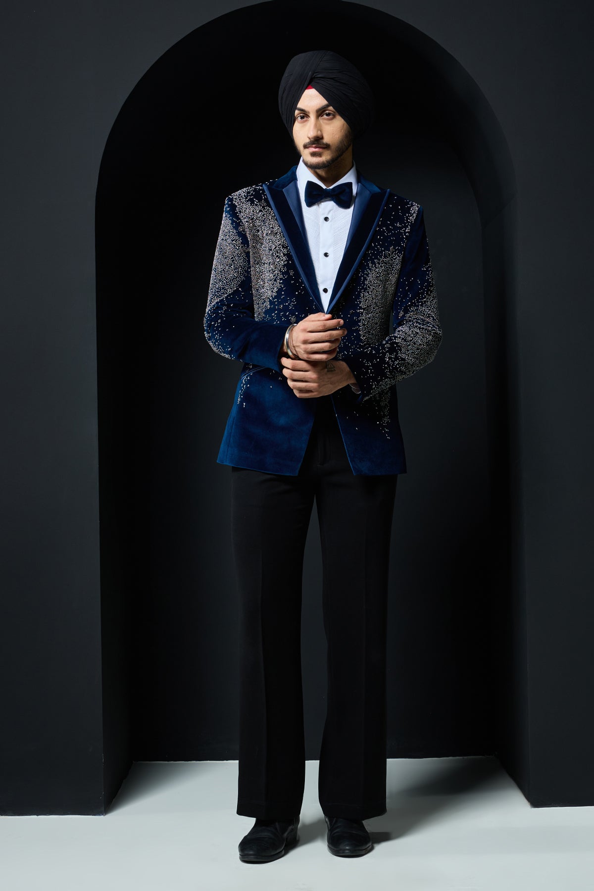 Teal blue tuxedo highlighted with sequins, pearls and cutdana