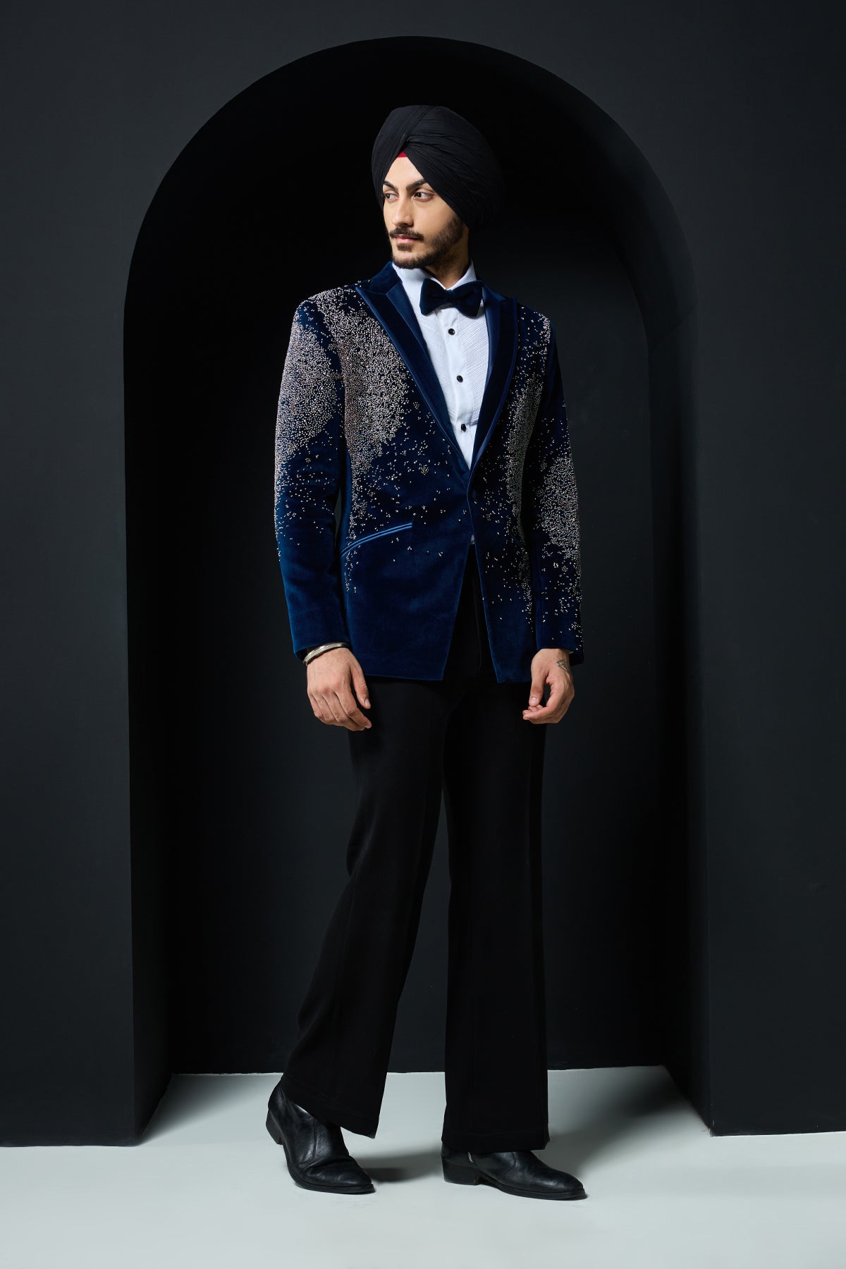 Teal blue tuxedo highlighted with sequins, pearls and cutdana