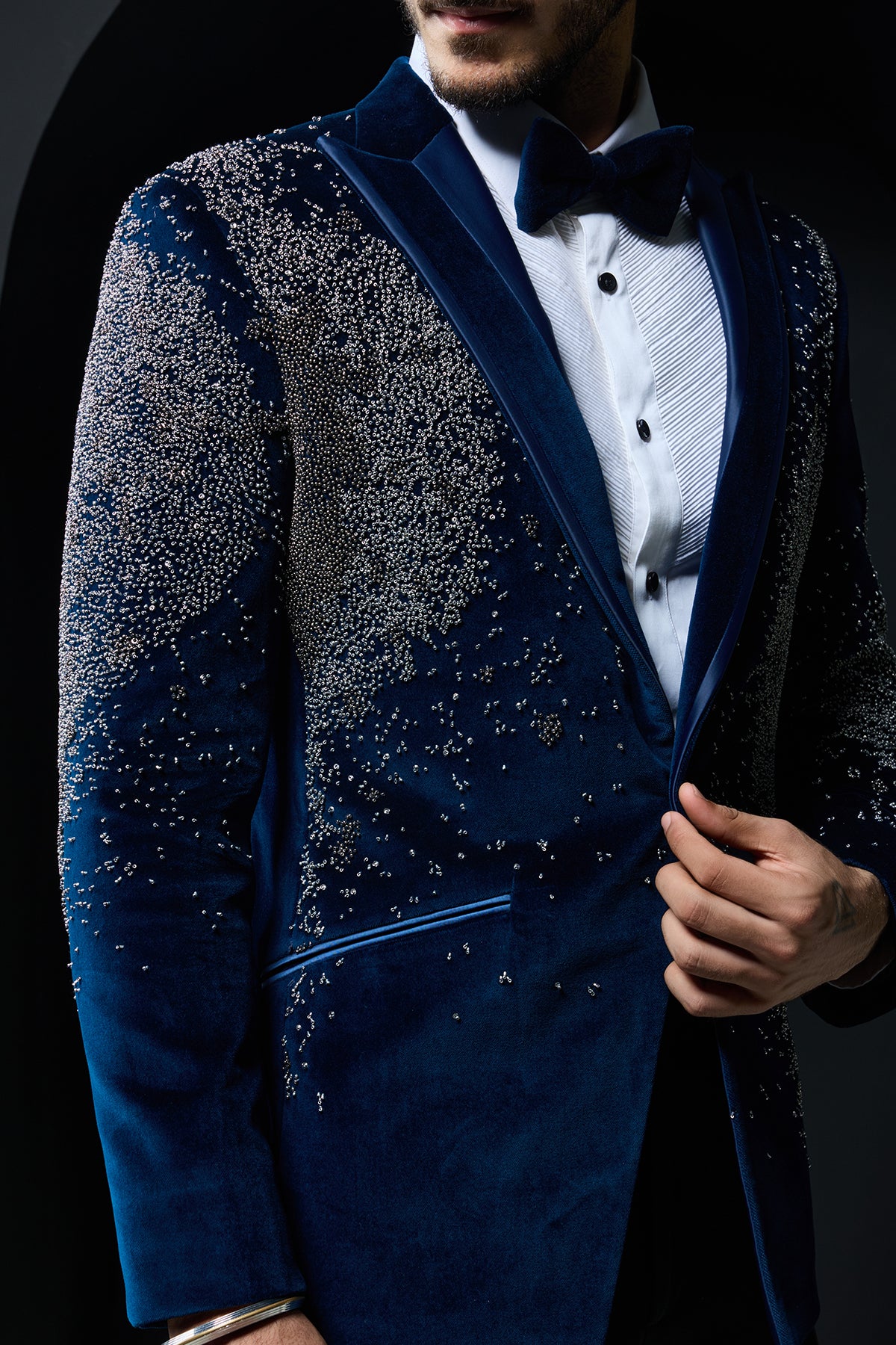 Teal blue tuxedo highlighted with sequins, pearls and cutdana
