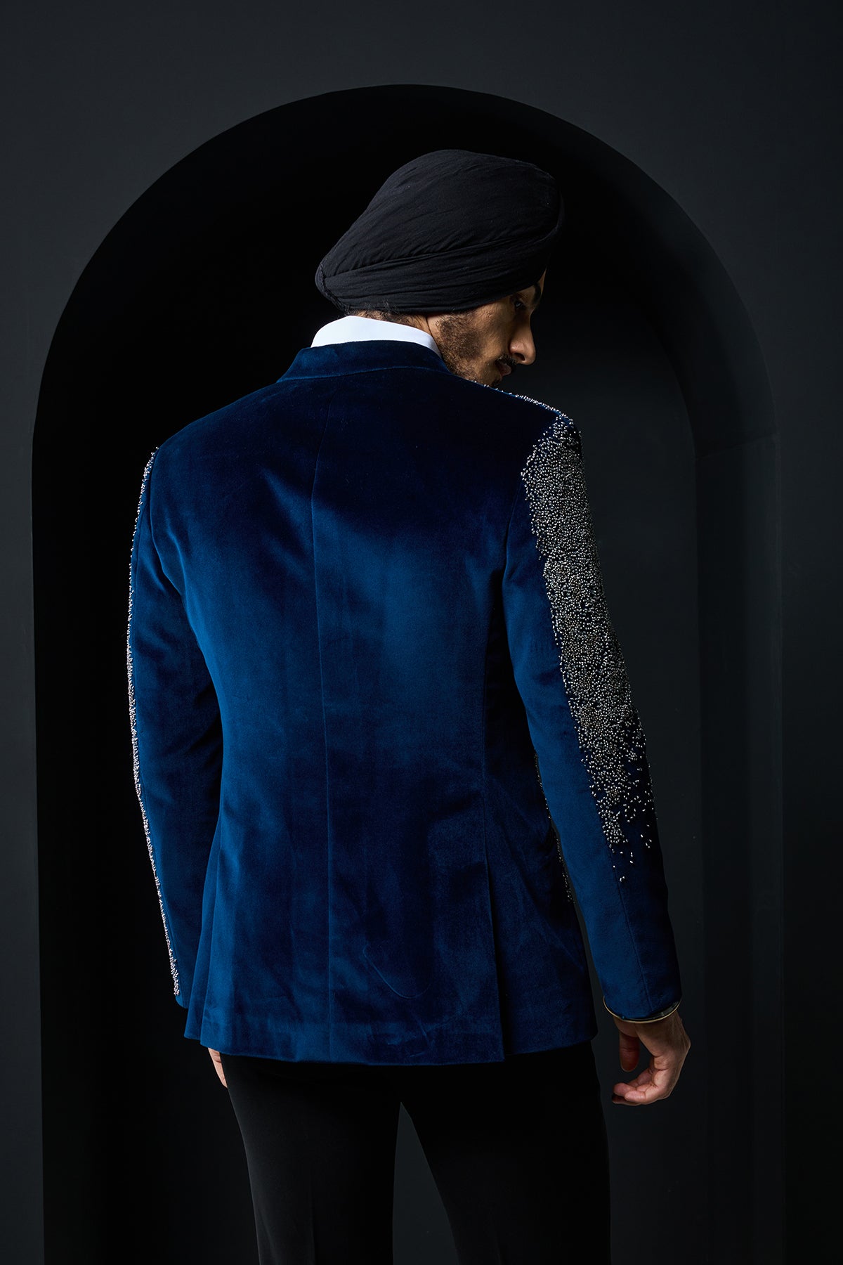 Teal blue tuxedo highlighted with sequins, pearls and cutdana