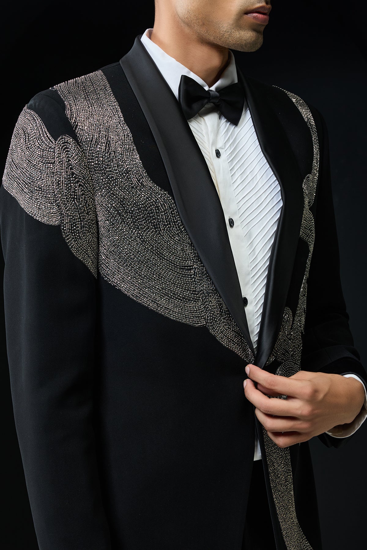 Black tuxedo highlighted with silver zari , cutdana and peals