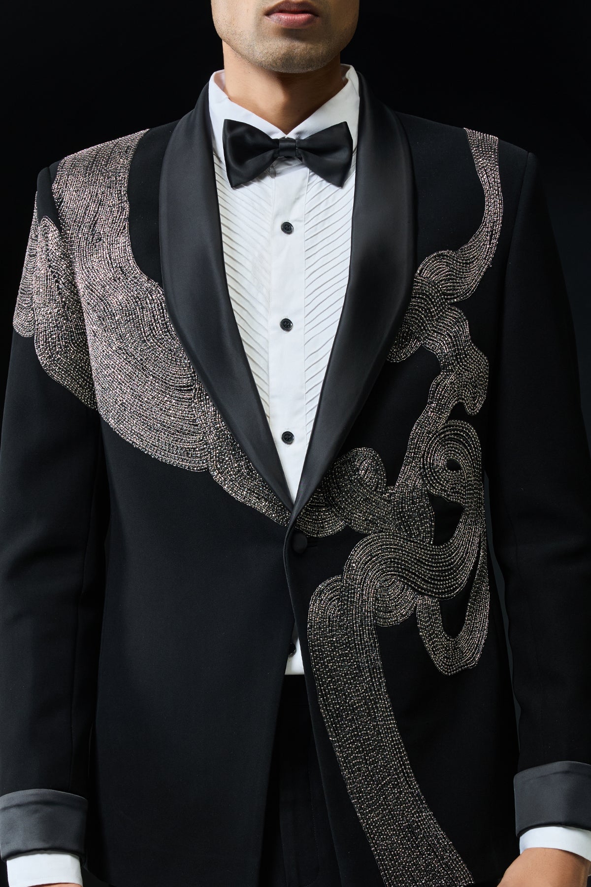 Black tuxedo highlighted with silver zari , cutdana and peals