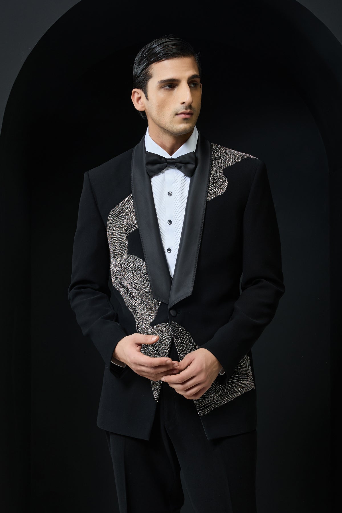 Black tuxedo highlighted with silver zari , cutdana and peals