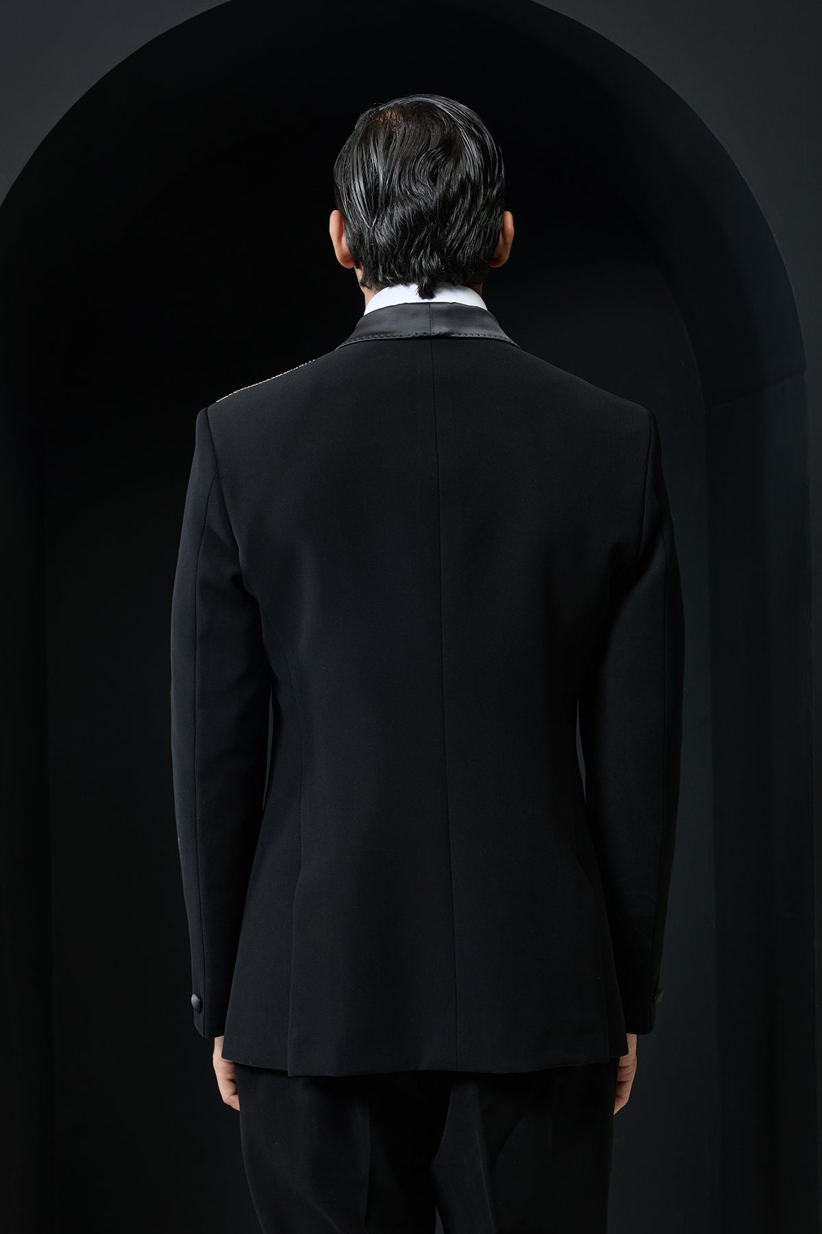 Black tuxedo highlighted with silver zari , cutdana and peals