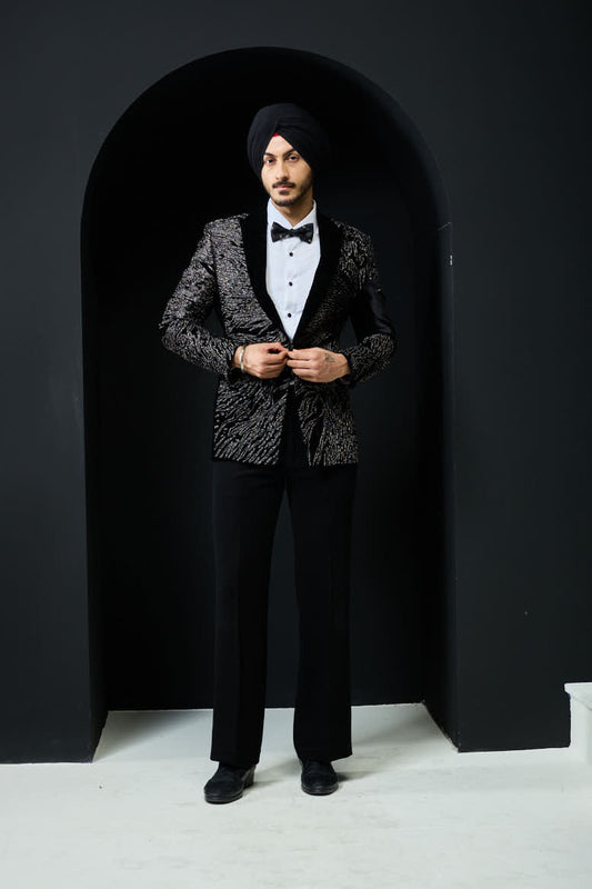 Black tuxedo highlighted with silver zari and peals
