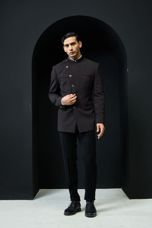 Black bandhgala with slant cut detailing with golden button and with satin taping