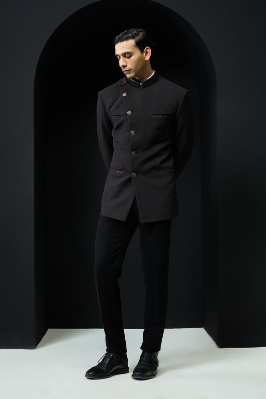 Black bandhgala with slant cut detailing with golden button and with satin taping